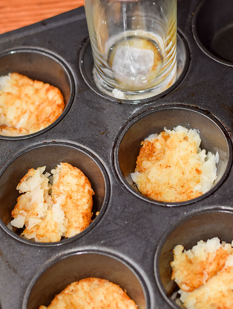 Use bottom of the glass or rubber spatula to press the hash browns